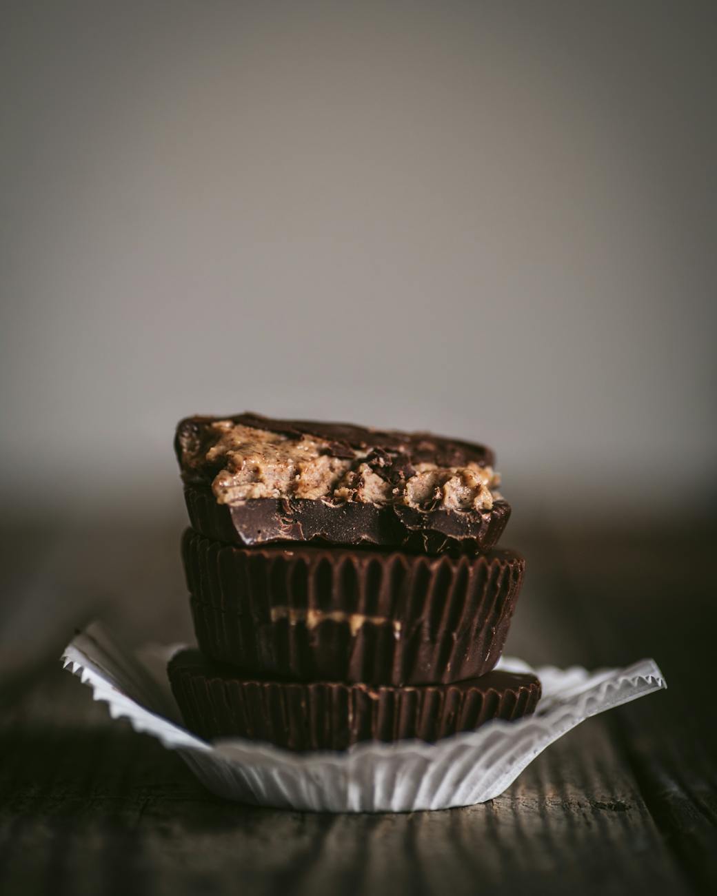 chocolate peanut butter cups in white paper cup