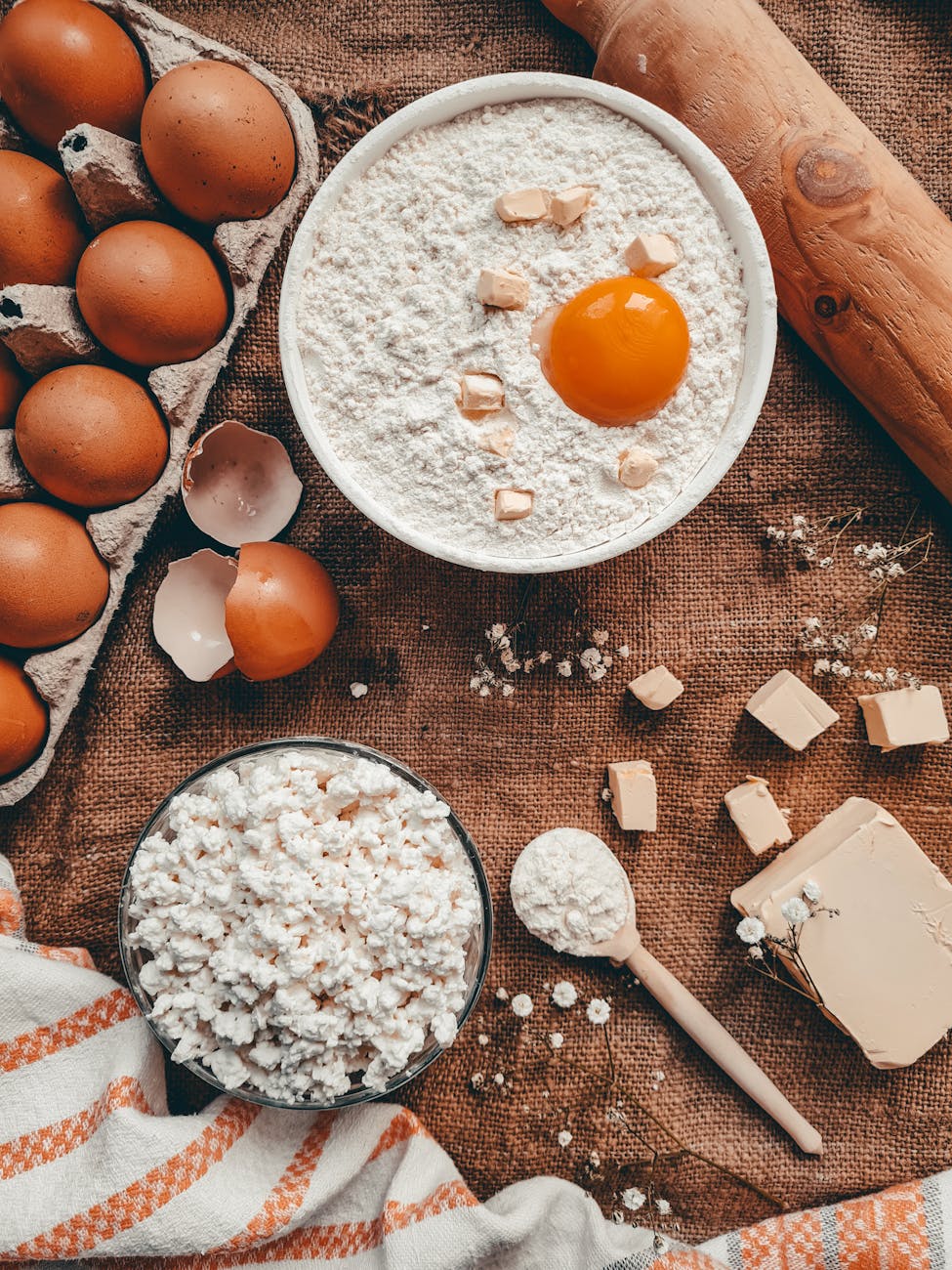 bowl of flour with an egg yolk